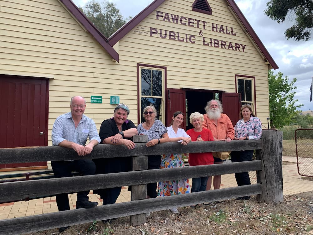 Fawcett Hall committee members outside in front of the Fawcett Hall Public Library