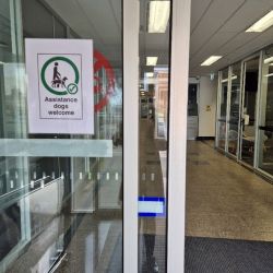 Entrance showing assistance dogs welcome sign