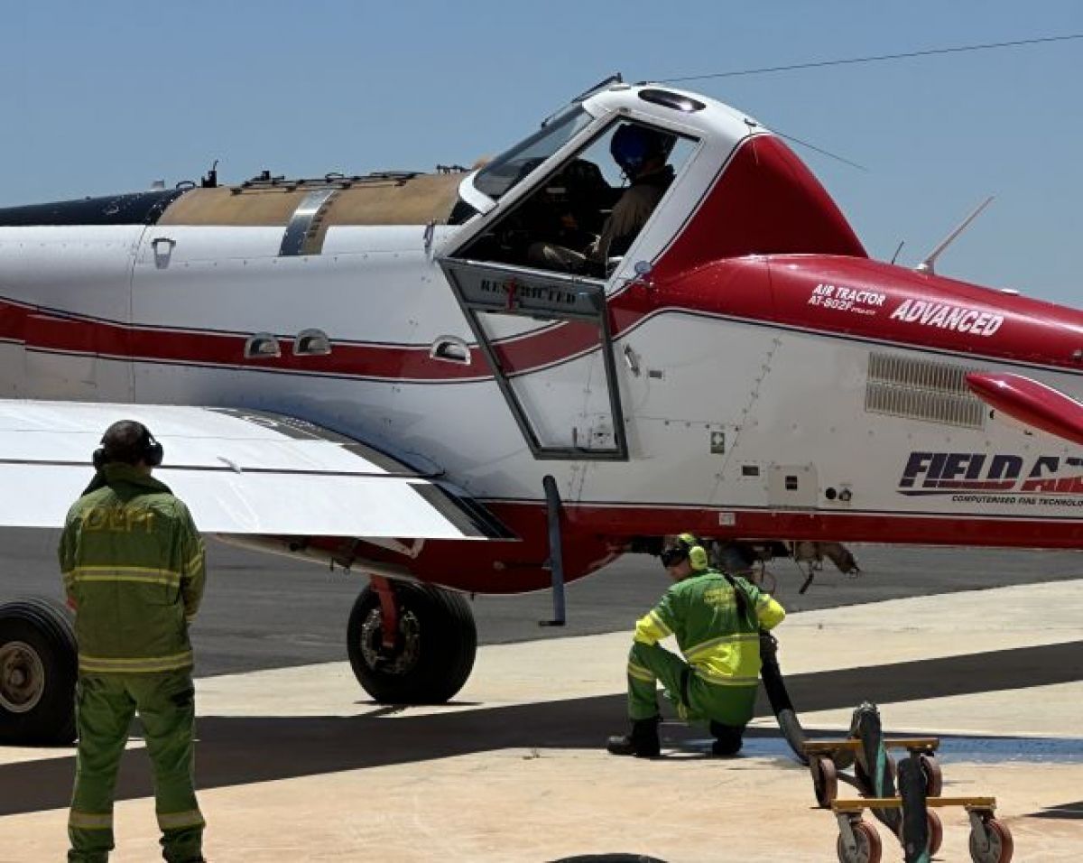 Emily fueling a plane