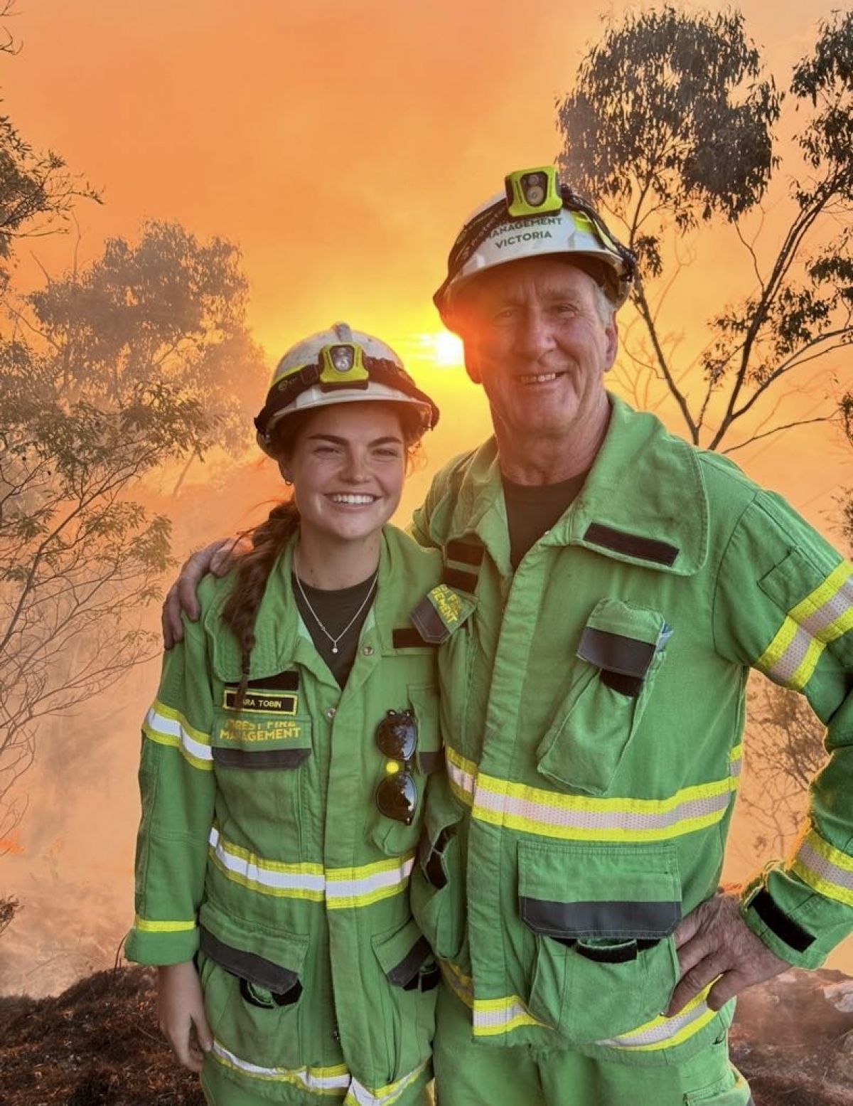 Lara Tobin with male firefighter in the forest
