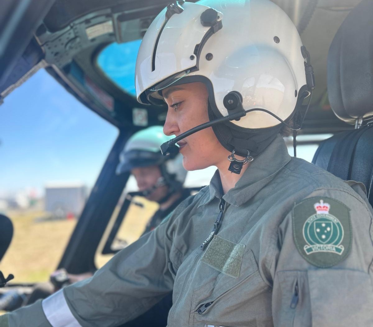 Kellie piloting a helicopter