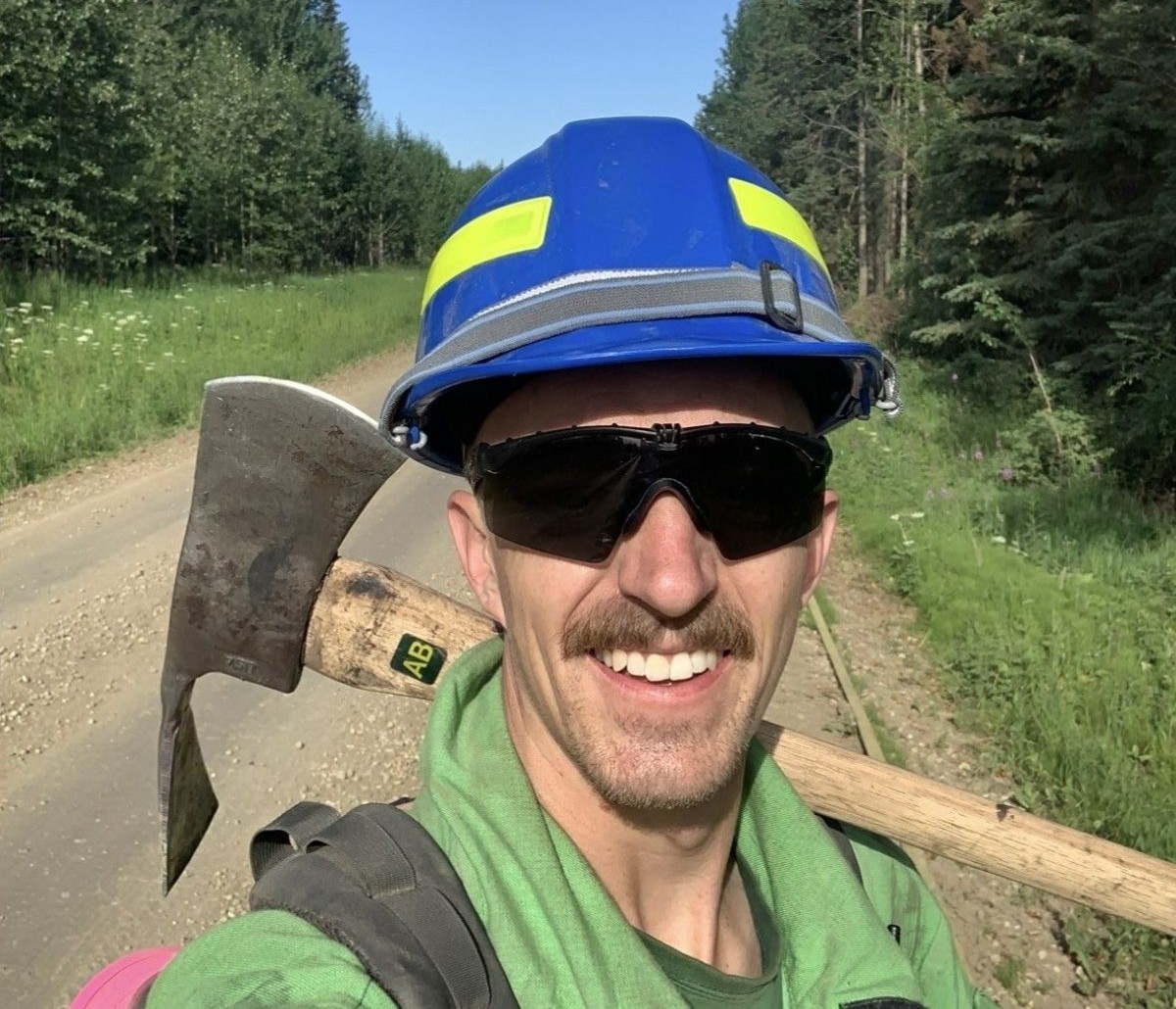 Mitch carrying an axe