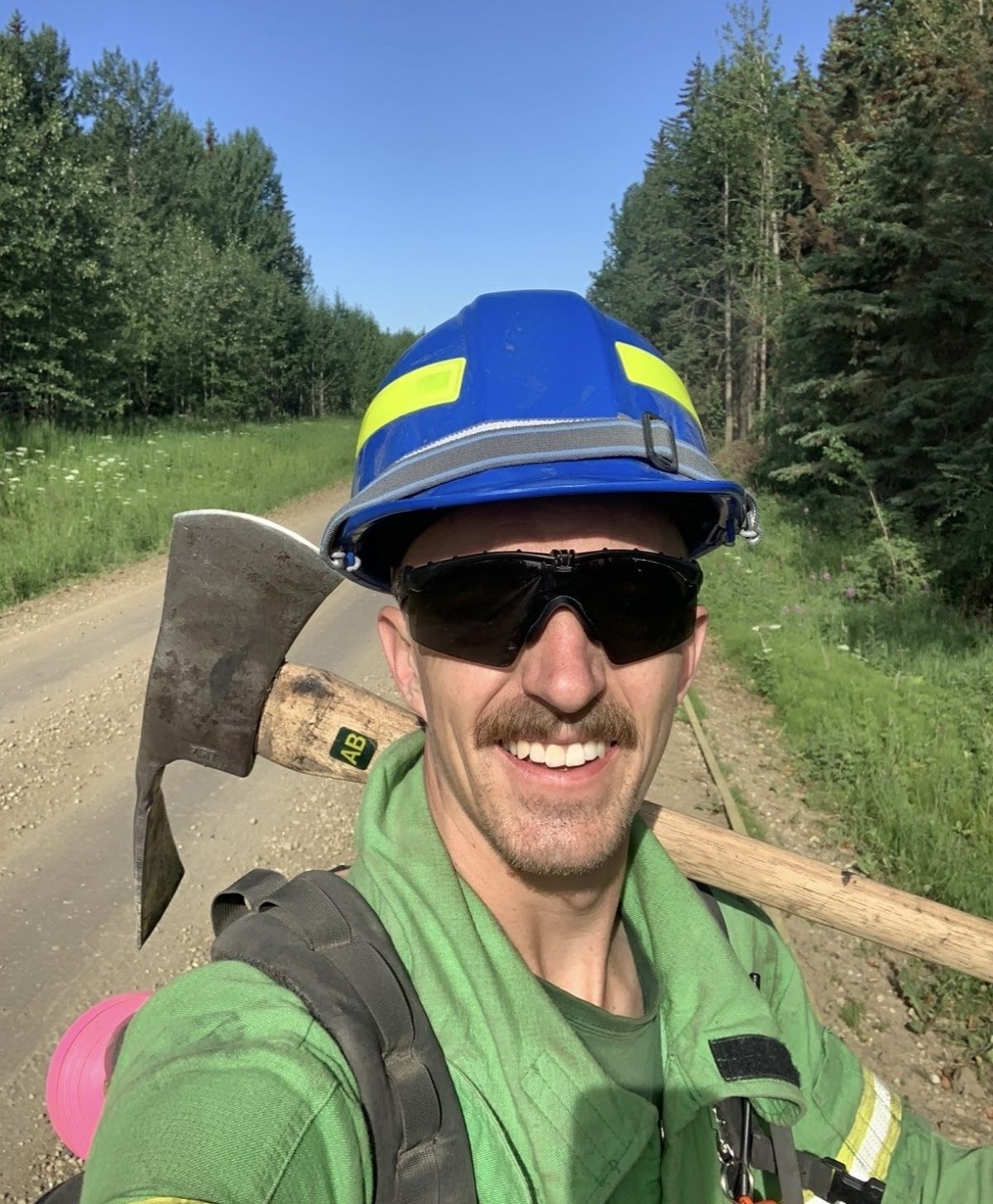 Mitch carrying an axe