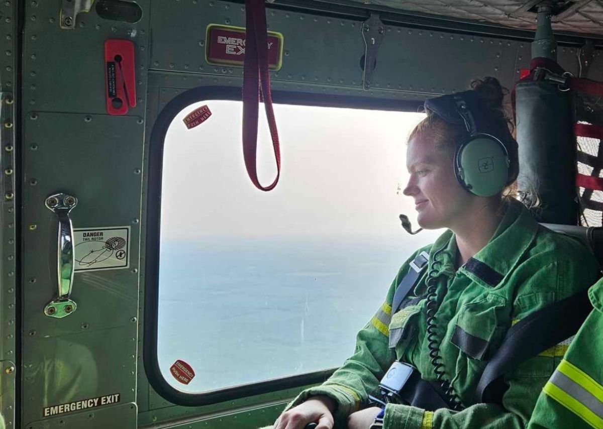 Brooke inside a helicopter