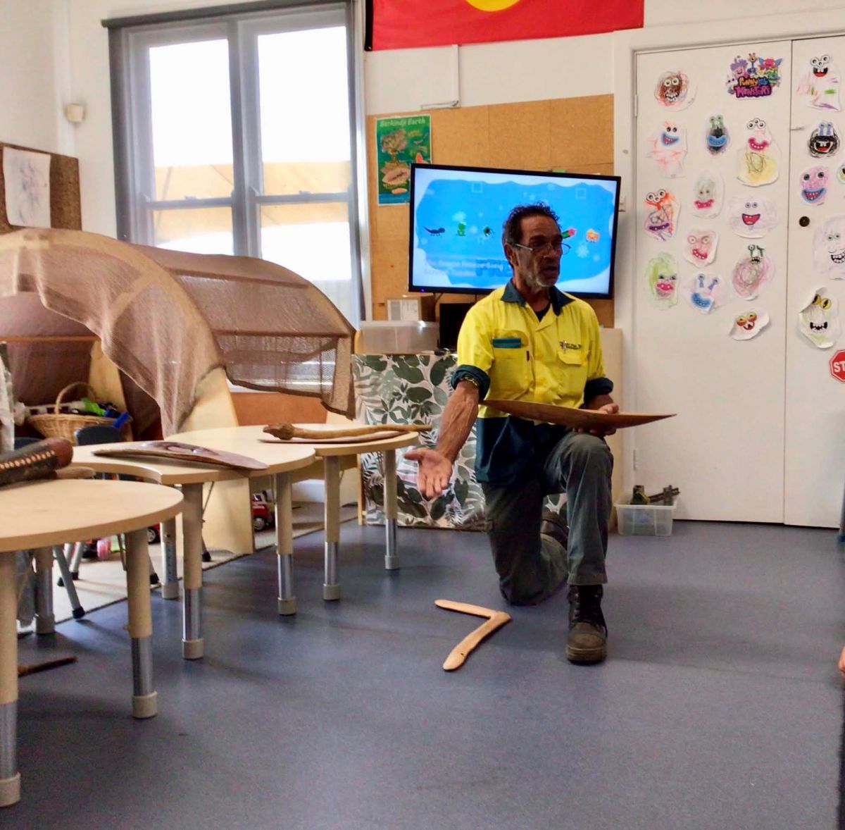 Uncle Will talking to students. Boomerang on the floor