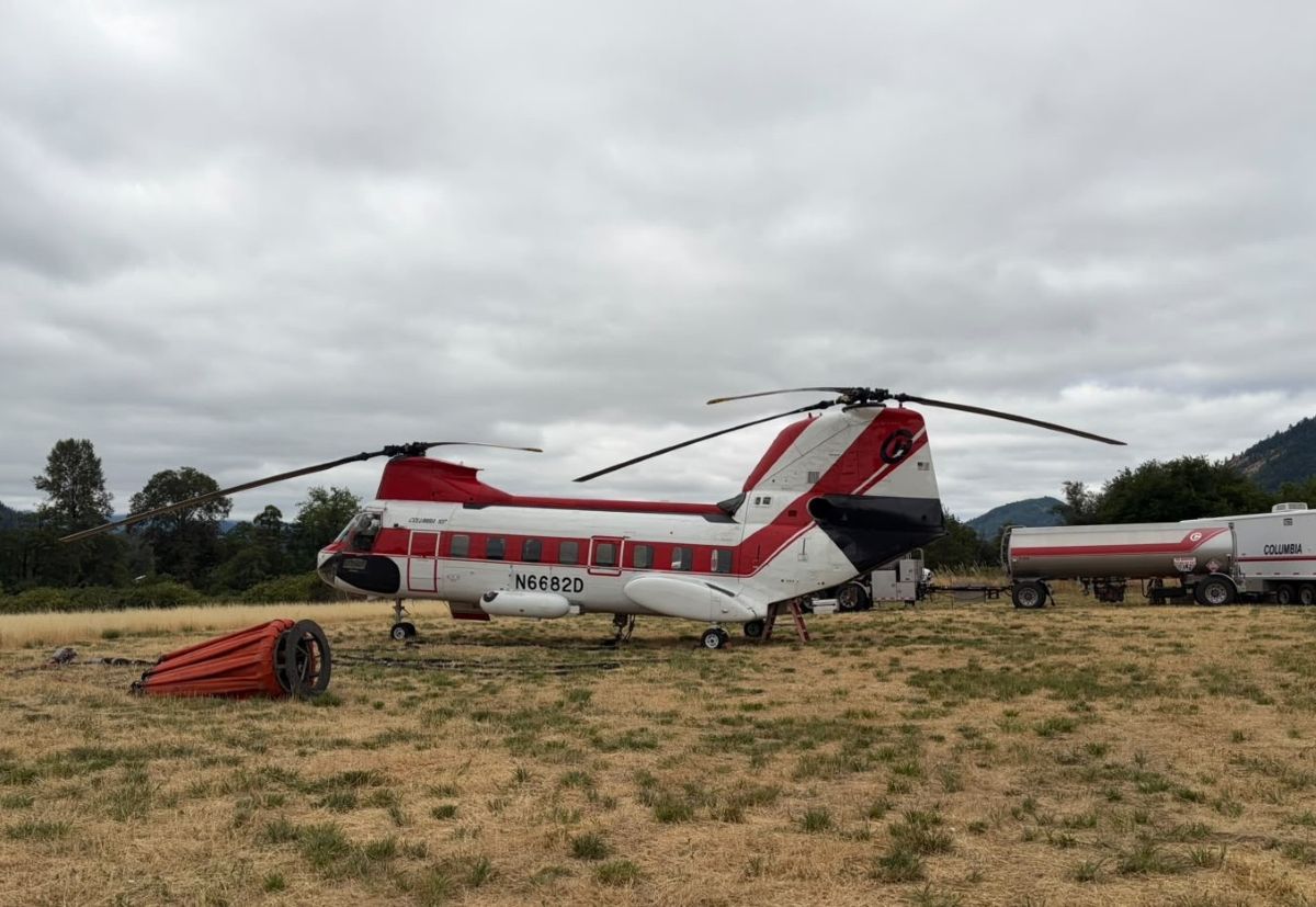 Photo of the white and red helicopter on the ground